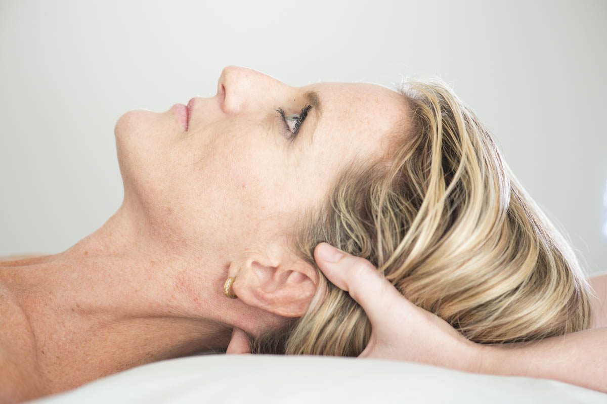 Gentle hands-on treatment of a patient's head and neck
